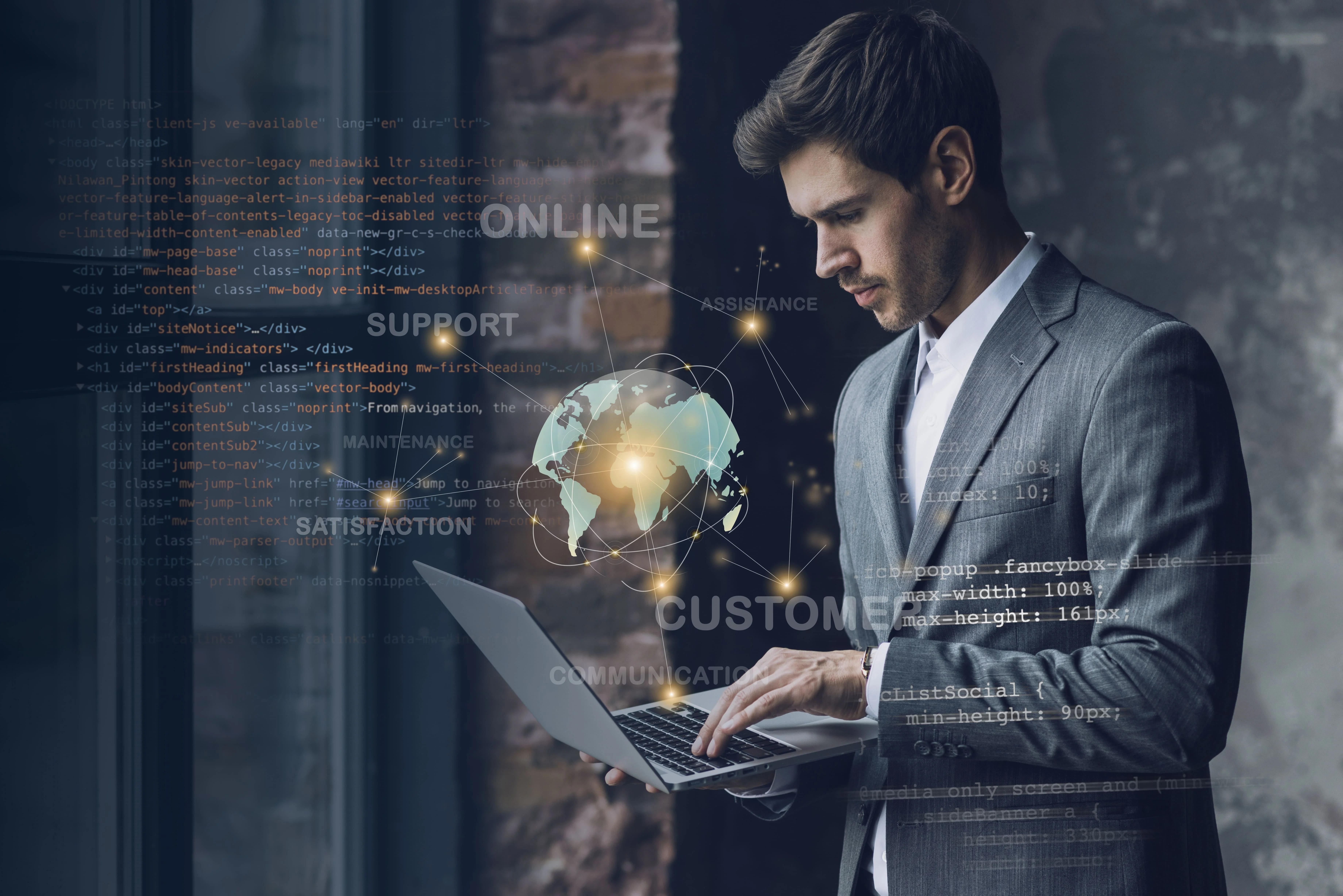 man standing with laptop